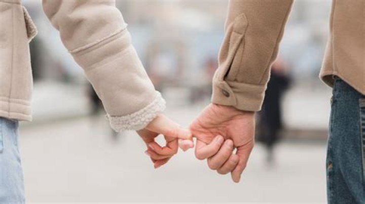 What does holding hands mean in Japan?